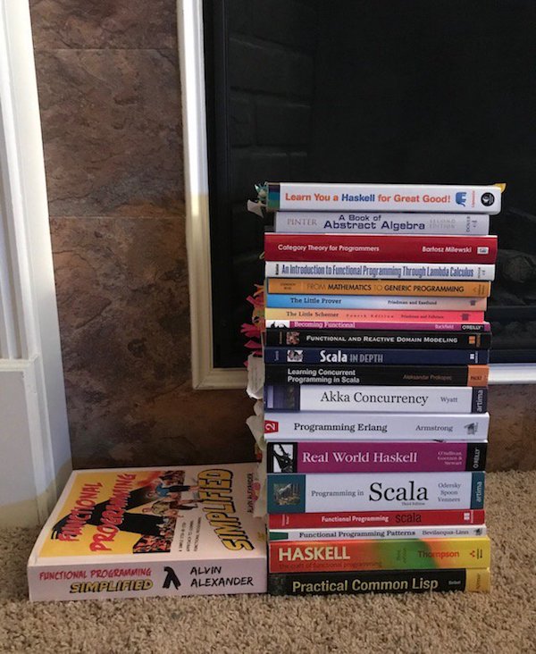 Books. The man has books.
